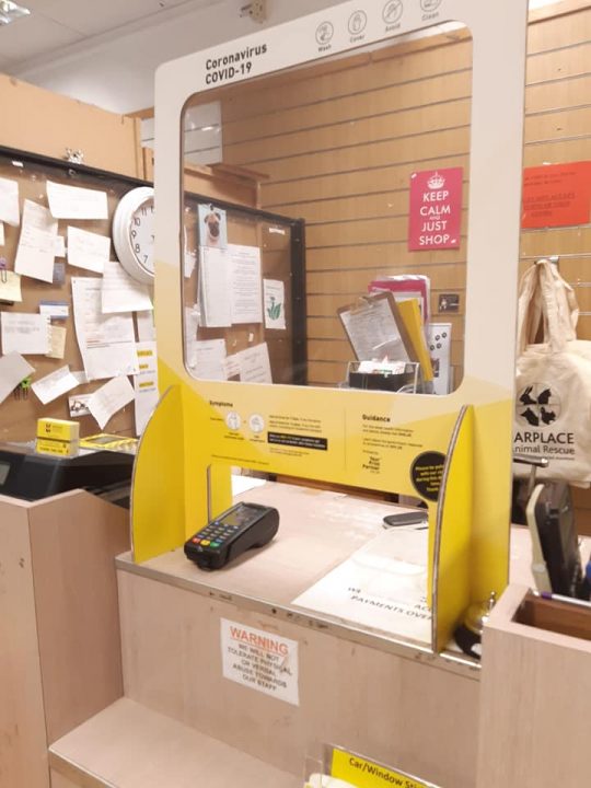 counter at shop with sneeze guard